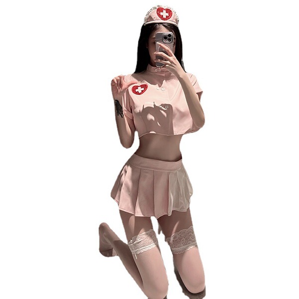 Pink nurse-themed lingerie set with crop top, pleated skirt, and lace thigh-highs for small bust.