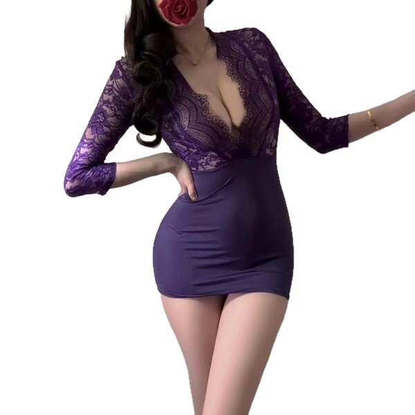A woman models the pure & playful lingerie set, featuring a deep purple lace bodice and matching sleepwear, perfect for coupl...