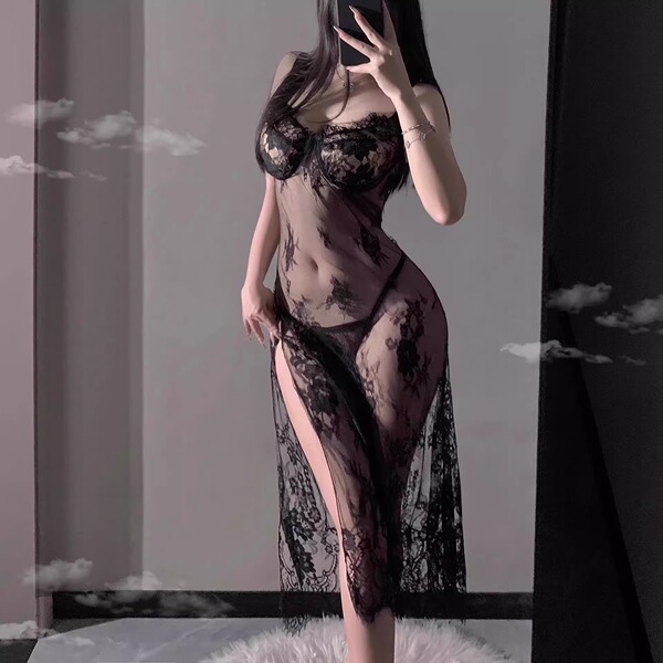 Woman wearing black lace lingerie set with sheer silk robe, seductive sleepwear style for romantic evenings.