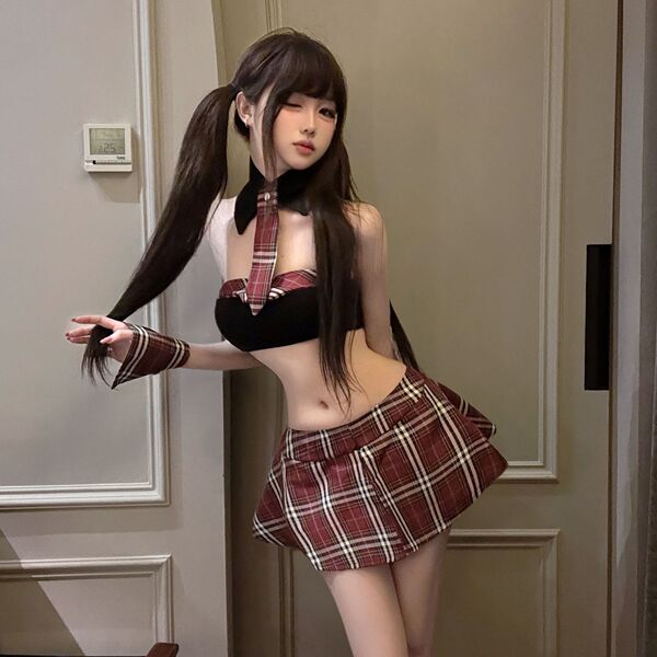 Woman modeling pure & playful lingerie set: red plaid pleated mini skirt, matching top, choker, and arm warmers in sexy schoo...