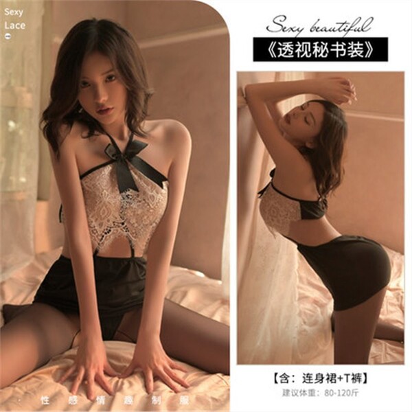 Woman modeling pure & playful lingerie sleep set – sexy lace bodysuit with black shorts, sheer stockings, and bow detail.