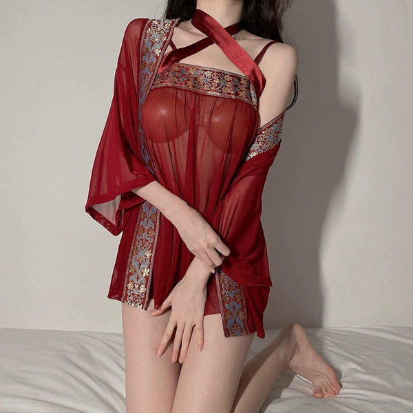 A woman models a luxurious red chinese-inspired lingerie set, featuring sheer mesh sleep dress with intricate embroidery and ...