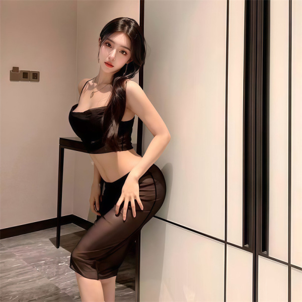 Woman wearing a sheer black lace bodysuit dress, posing indoors with elegant lighting. pure & seductive lingerie set for wome...