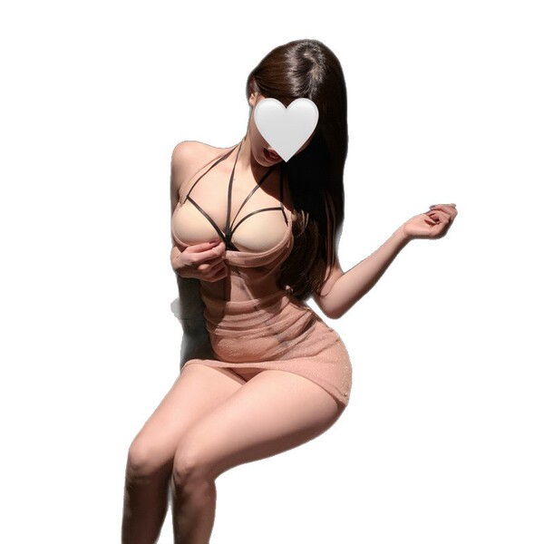 Woman modeling pure & seductive lingerie set with sheer mesh bodycon skirt and matching bralette, posing elegantly.