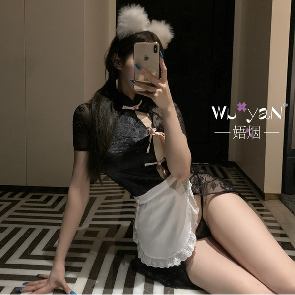 A woman poses with a smartphone, wearing a black lace qipao-style dress paired with a white apron and fluffy headband. the ou...
