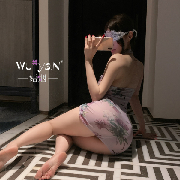 Woman wearing pure & seductive lingerie set - modest yet sexy qipao-style cosplay sleepwear with sheer mesh details, sitting ...