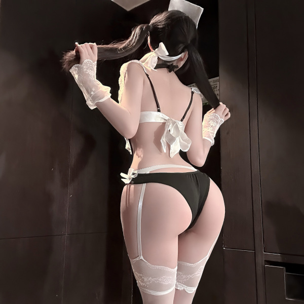 Woman wearing pure & seductive bunny girl lingerie set with open-crotch design, lace gloves, and thigh-high stockings.