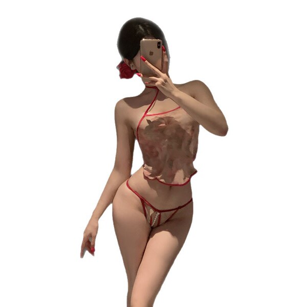 Woman in red lingerie set taking mirror selfie, wearing sheer bodysuit with floral pattern and matching thong, modest yet sex...