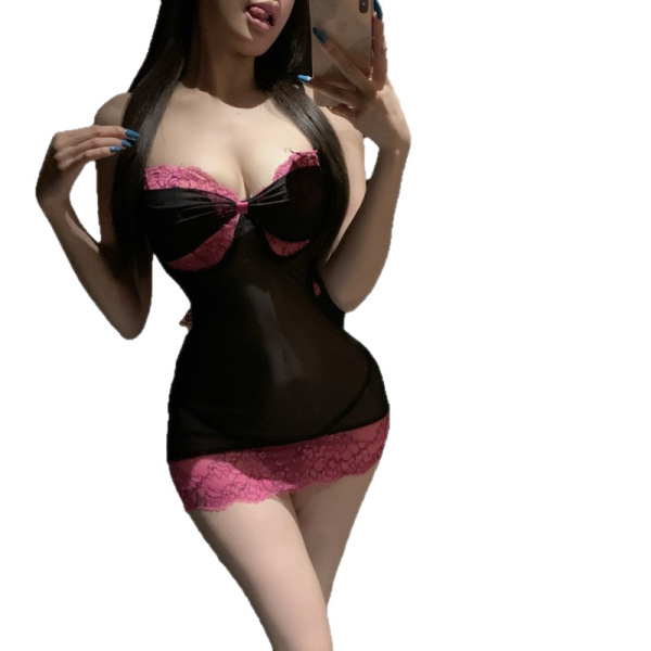 Woman in black and pink lace lingerie set, featuring a sheer bodice and matching shorts, styled as naughty secretary sleepwea...