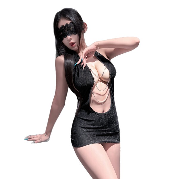 Woman in black pure & seductive lingerie set with lace mask and body chains, playful sleepwear for romantic nights.