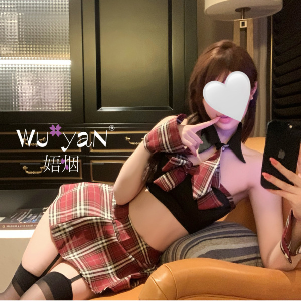 Woman posing in pure & seductive lingerie set – sexy qqny style jk uniform skirt, high-end tempting outfit with plaid details...