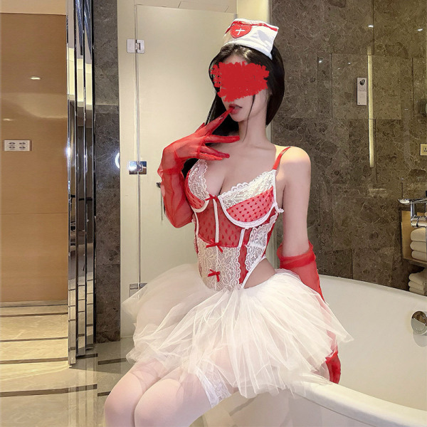Woman in pure & seductive nurse costume set with lace bodysuit, heart detail, white tutu skirt, red gloves, and nurse hat.