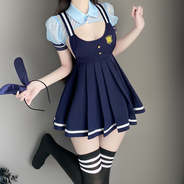 A stylish ensemble featuring a navy blue pleated suspender skirt with white trim, paired with a light blue blouse and black k...