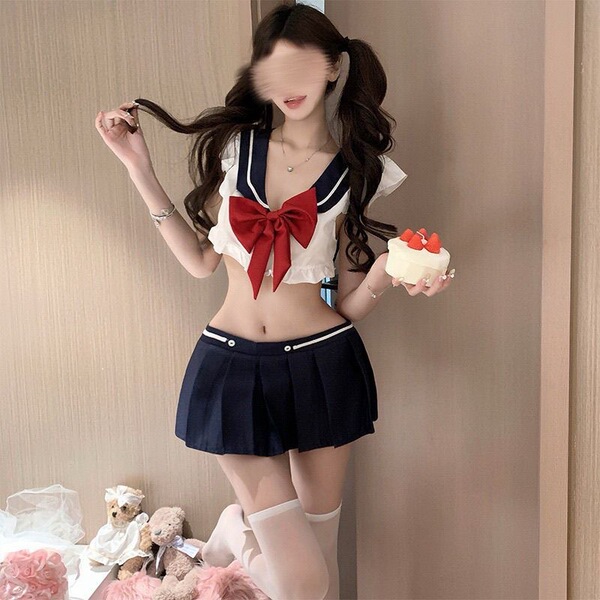 A woman models the pure temptation jk sleepwear set, featuring a sexy sailor uniform short skirt outfit. the kawaii schoolgir...