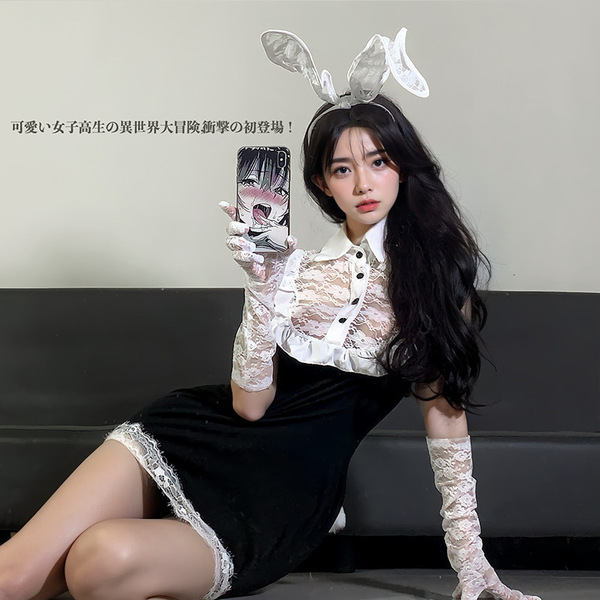 A stylish woman poses with bunny ears and lace gloves, wearing a black bodycon dress with white lace details. the outfit feat...
