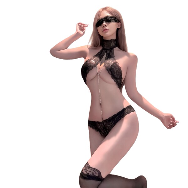 Woman wearing black pure temptation lace bodysuit with sheer cutouts, bondage-inspired design, and matching blindfold.