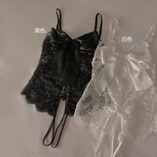 Pure temptation lace bodysuit in black and white, featuring sheer fabric, cut-out details, and a provocative uniform style wi...