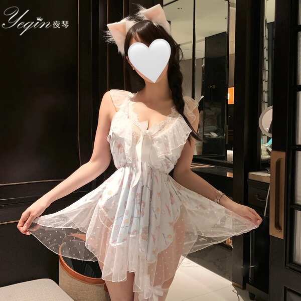 A woman models a delicate white lace sleep dress with cat ears, featuring a deep v-neckline and flowing tulle skirt, perfect ...