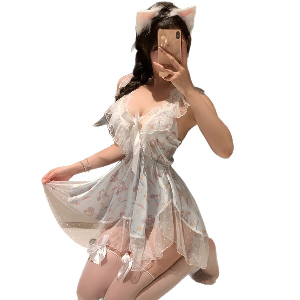 A woman poses in a luxurious lace sleep dress featuring a deep v neckline and playful cat ears, perfect for elegant nightwear...