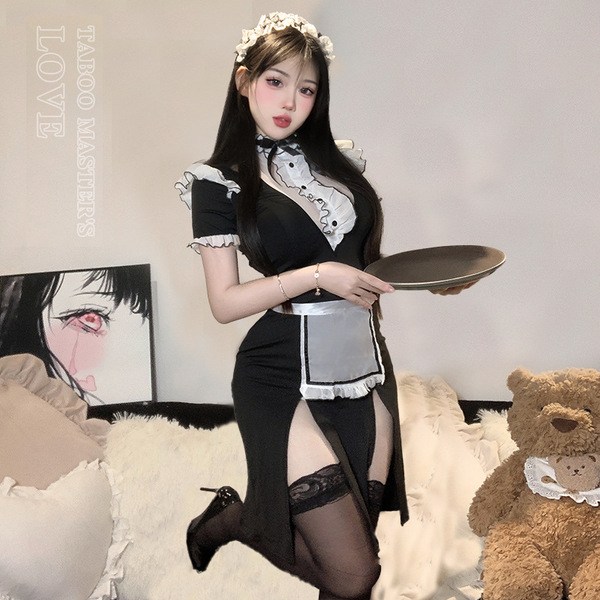 A woman poses wearing a black maid costume with lace details, holding a tray. the outfit features a revealing design and thig...