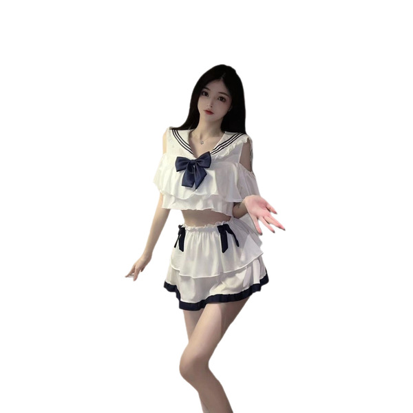 A woman models a navy collar bow skirt student lingerie sleepwear set, featuring ruffled details and a playful design.