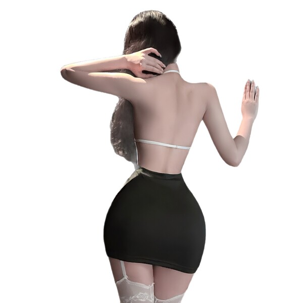 Woman wearing pure & tempting lace bodysuit, showing sheer mesh back and flirty cutouts with black skirt.