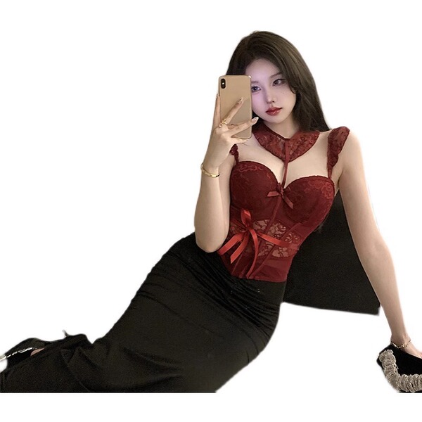 A woman poses with a smartphone, wearing a red lace bodysuit featuring a push-up corset design and a black skirt. the set inc...