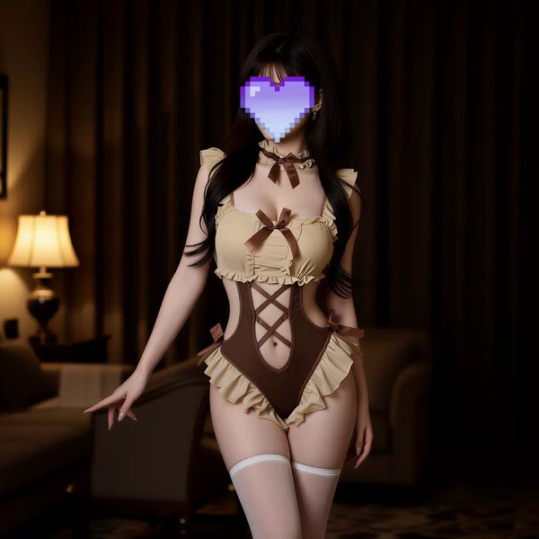 Woman wearing pure & tempting vintage lace bodysuit with bow tie and ruffled backless design in dimly lit room.