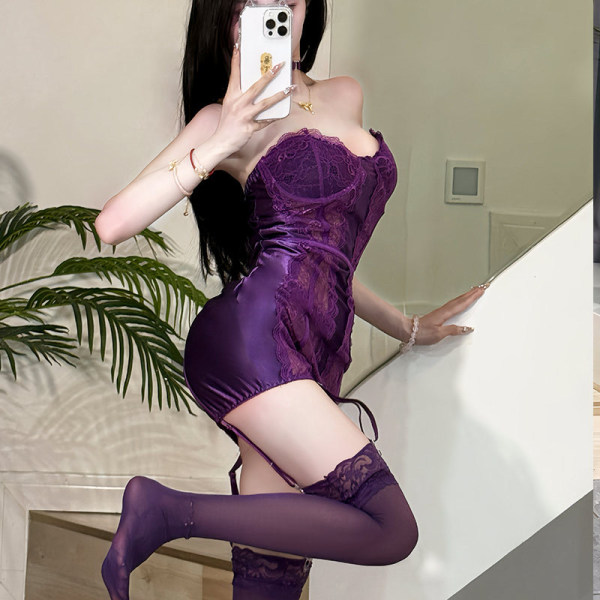 Woman wearing purple lace bodysuit with sheer stockings, posing in mirror selfie. sexy seamless thong design enhances curves.