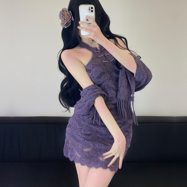A woman poses in a purple lace cheongsam dress, featuring a halter neck design and flowing shawl, perfect for a flirty party ...