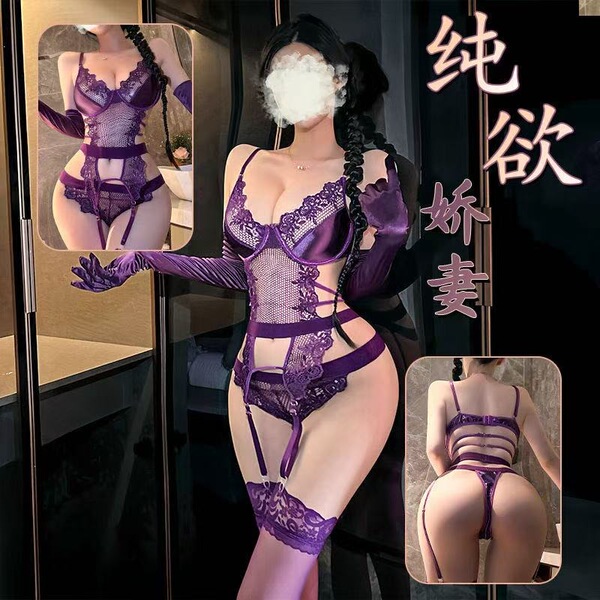 Model wearing purple lace lingerie set with sheer embroidered bra, panty, and garter straps in passionate pose.