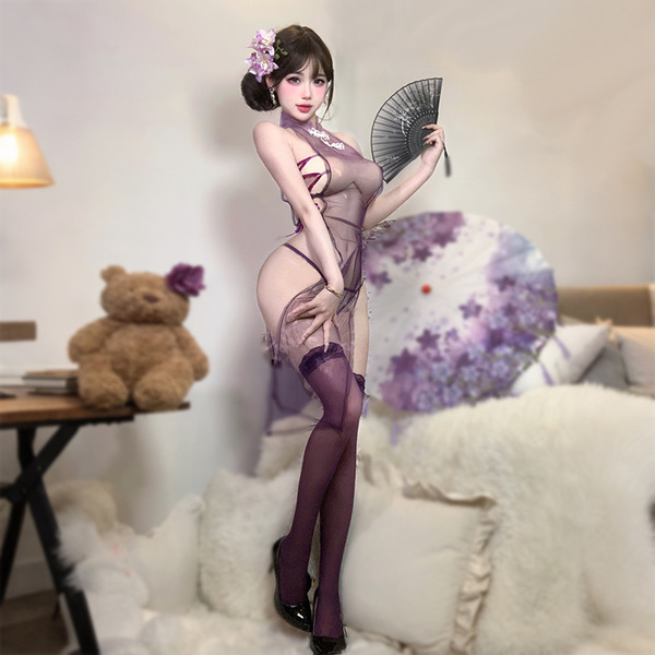 A woman poses elegantly in a purple sensual lingerie set featuring a modest-chic design with sheer mesh and ties, no-remove s...