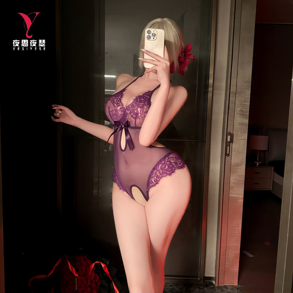 Woman modeling purple lace lingerie set with open-crotch design, featuring sheer fabric and bow detail.