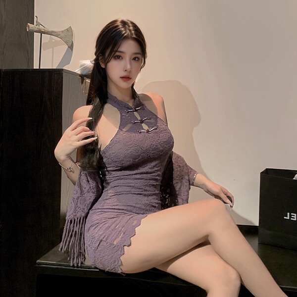 A woman poses elegantly in a purple sheer chinese-inspired lingerie set, featuring a delicate lace design and stylish cutouts...
