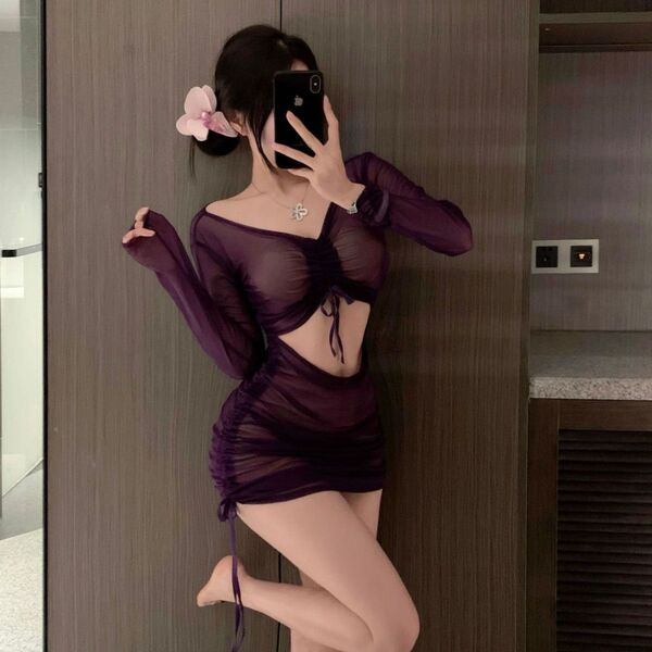 Woman wearing purple sheer lace lingerie set with ruched mini dress and drawstring waist, styled as seductive nurse costume s...