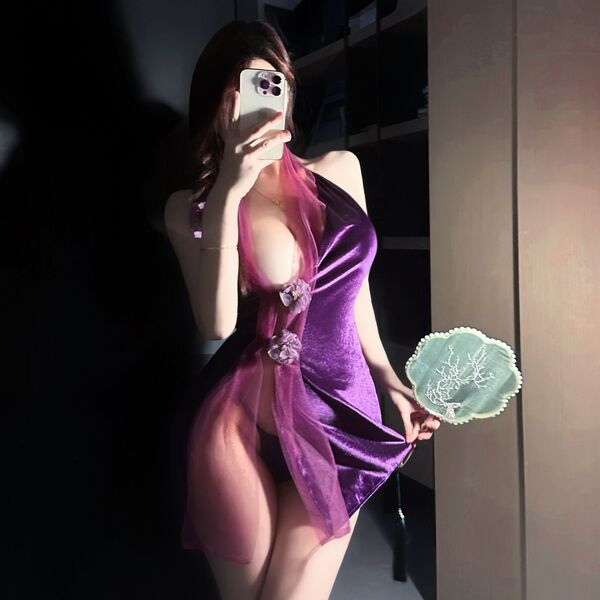 A woman poses with a smartphone, wearing a purple silk-look sensual hanfu lingerie set. the outfit features a deep v-neckline...