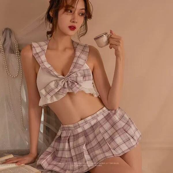 A stylish qingran sexy plaid jk uniform set featuring a plaid top with a bow tie, lace-up detail, and cut-out design, perfect...