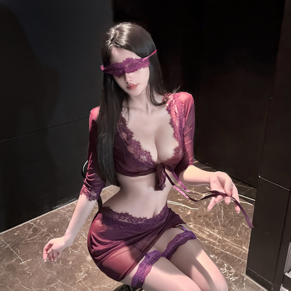 Woman wearing qingshe lace lingerie set with blindfold, featuring deep v top and gartered shorts in rich burgundy.