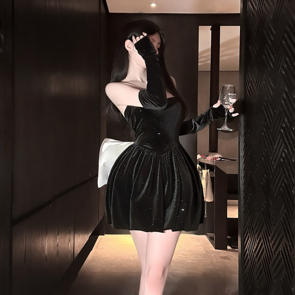 Elegant black velvet dress with sparkling details, perfect for evening events. features a strapless bodice and flowing skirt ...