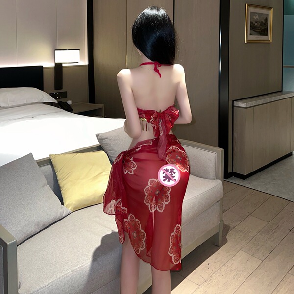 A woman stands facing away from the camera, wearing a red sheer hanfu dress inspired by the style of the ancient city of dunh...