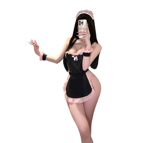 Woman in black and pink lace sleepwear set taking a selfie, showcasing the qqny pure allure elegant nightwear design.