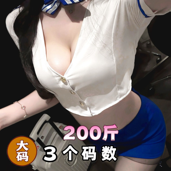Woman wearing qqny pure allure lingerie set, elegant white top with blue shorts, sensual and sophisticated bedroom wear.