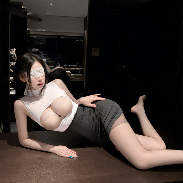 Woman in qqny pure allure lingerie set – white top, gray skirt, lace eye mask, posing seductively on table.