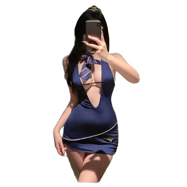 Woman wearing qqny pure allure sleepwear set, elegant blue lingerie with tie detail, luxury bedroom wear for women.