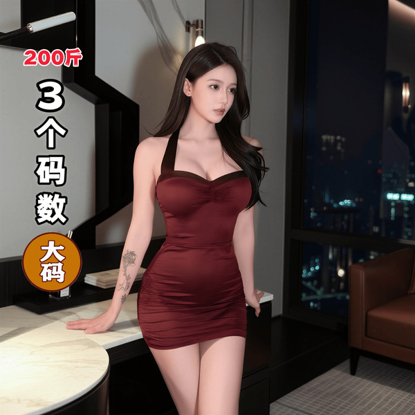 A woman stands confidently wearing a form-fitting, deep red dress with halter straps. the setting appears luxurious, featurin...