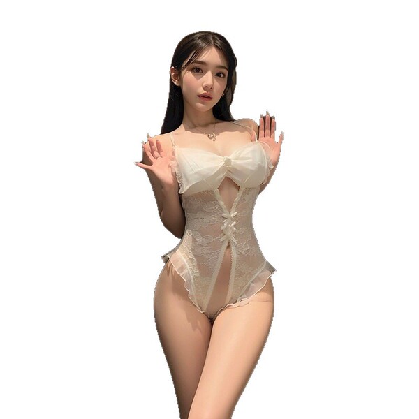 Woman modeling qqny pure allure sleepwear set – elegant white lace lingerie with bow detail and sheer panels.