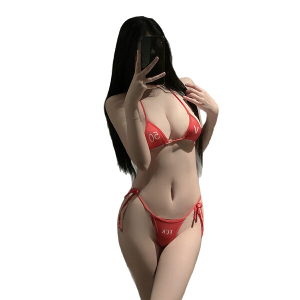 Woman wearing red qqny pure allure sleepwear set, elegant seductive lingerie with triangle top and tie-side bottoms.