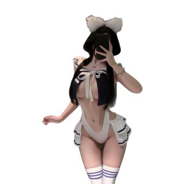 Woman in qqny pure allure sleepwear set with cat ears, bow top, and striped socks, posing elegantly for a mirror selfie.
