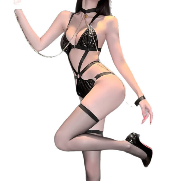 Woman wearing qqny pure allure black lingerie set with chains, garters, and heels – sensual sleepwear for elegant allure.