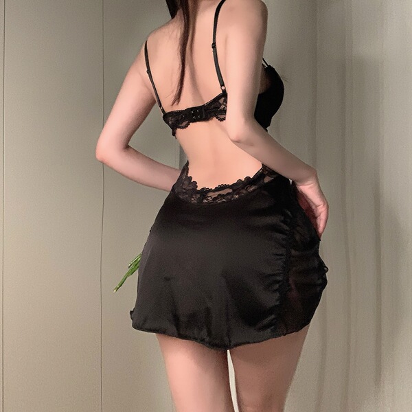 Woman wearing black queen french deep v backless velvet cami set with lace trim, elegant sleepwear for women.